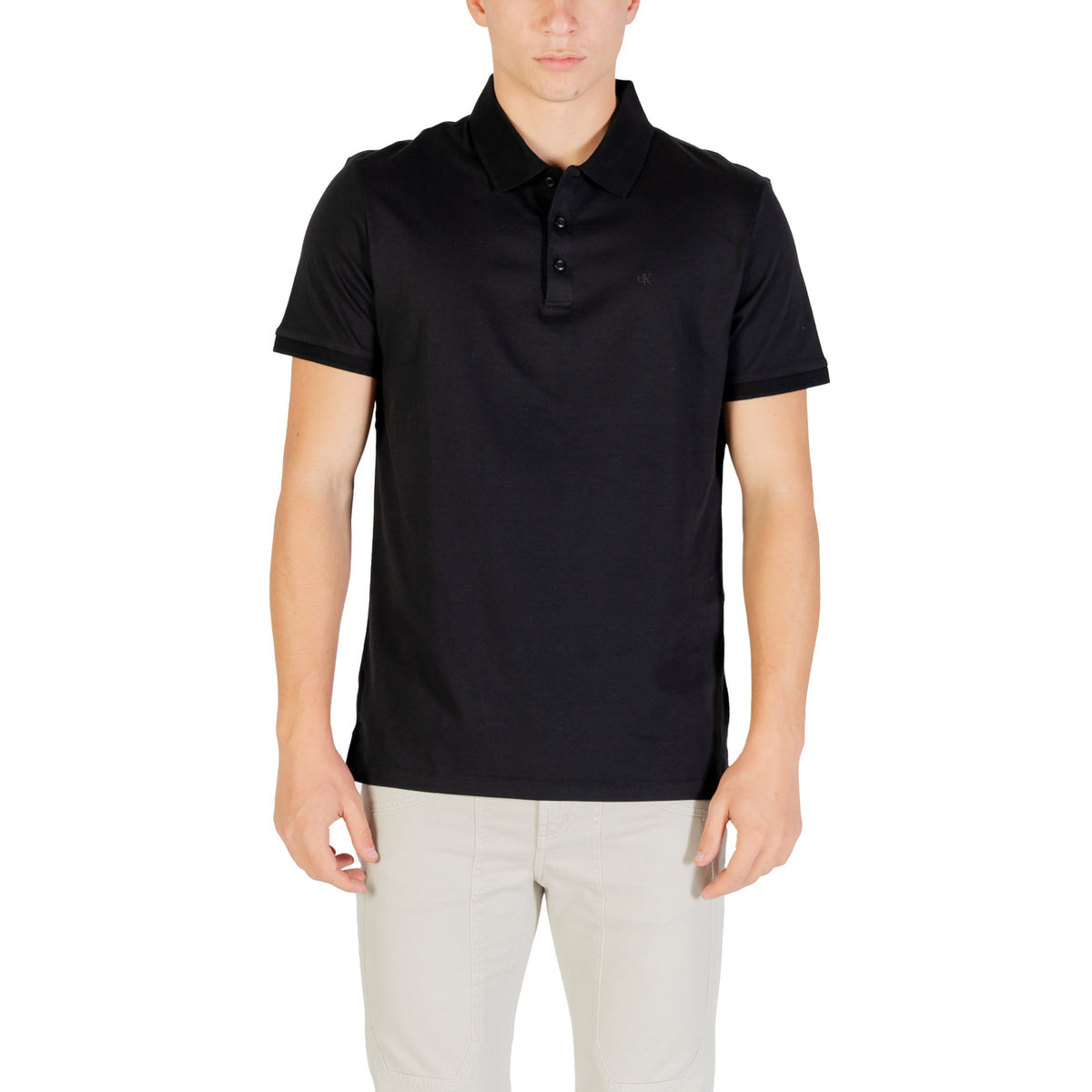 Image 1 : Polo Calvin Klein Jeans homme noir manches courtes, vue de face — Delvale