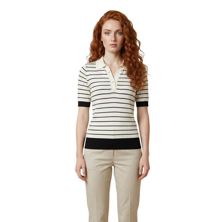 Image 1 : Femme portant un polo Liu Jo à rayures marinières crème et noir, col polo boutonné, manches courtes avec finition côtes noires, coupe ajustée — Delvale