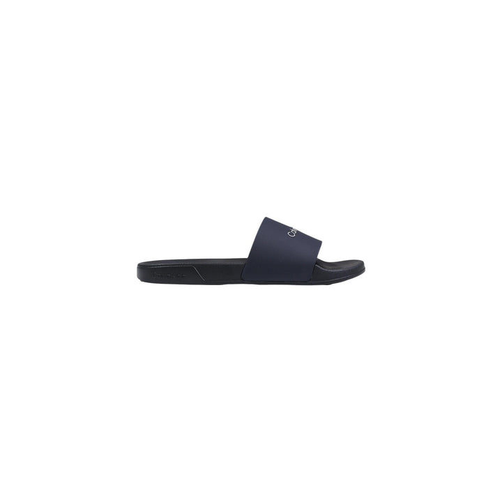Image 1 : Mules Calvin Klein homme noires en polyuréthane, vue de profil — Delvale
