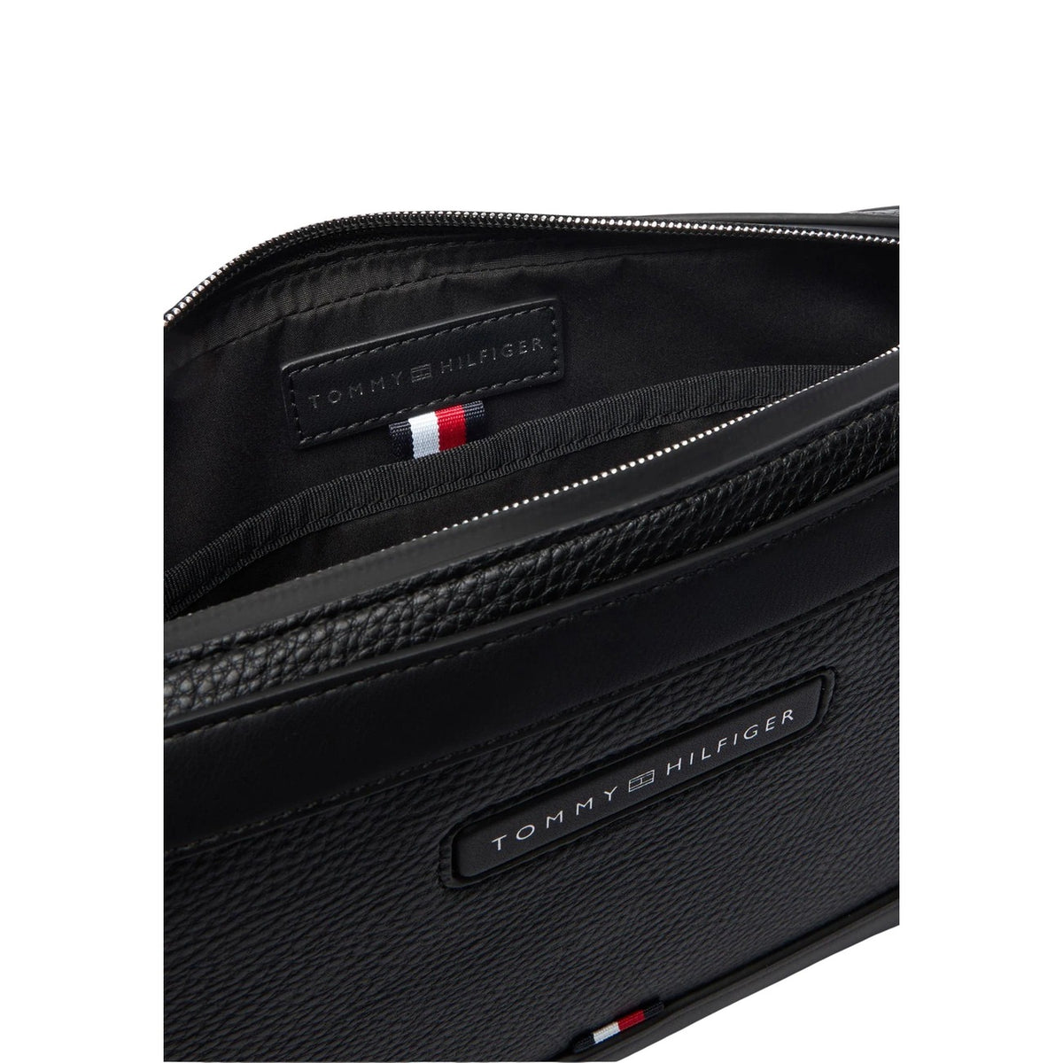 Image 5 : Pochette zippée Tommy Hilfiger homme noire posée à plat, format business élégant et compact — Delvale