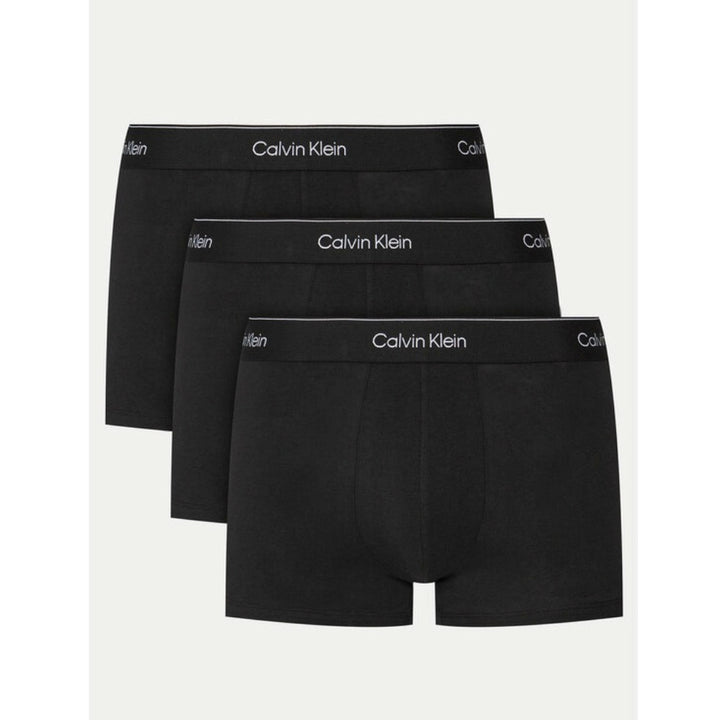 Image 1 : Lot de 3 boxers trunks Calvin Klein Underwear homme coloris noir avec ceinture élastique logo blanc sur fond blanc — Delvale