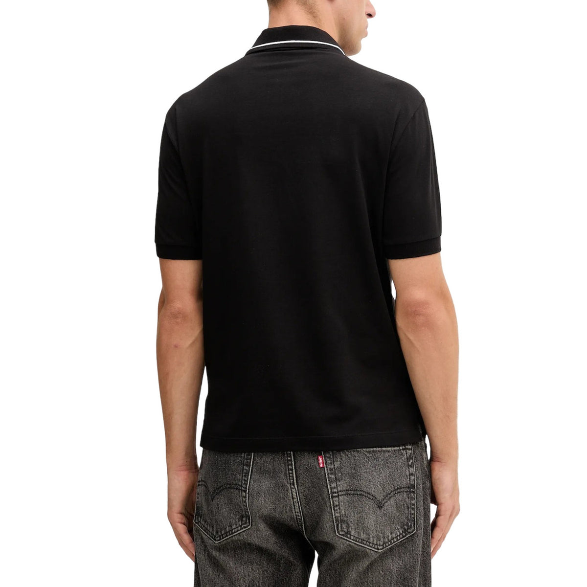 Image 3 : Polo Armani Exchange homme noir porté avec jean gris look smart casual — Delvale