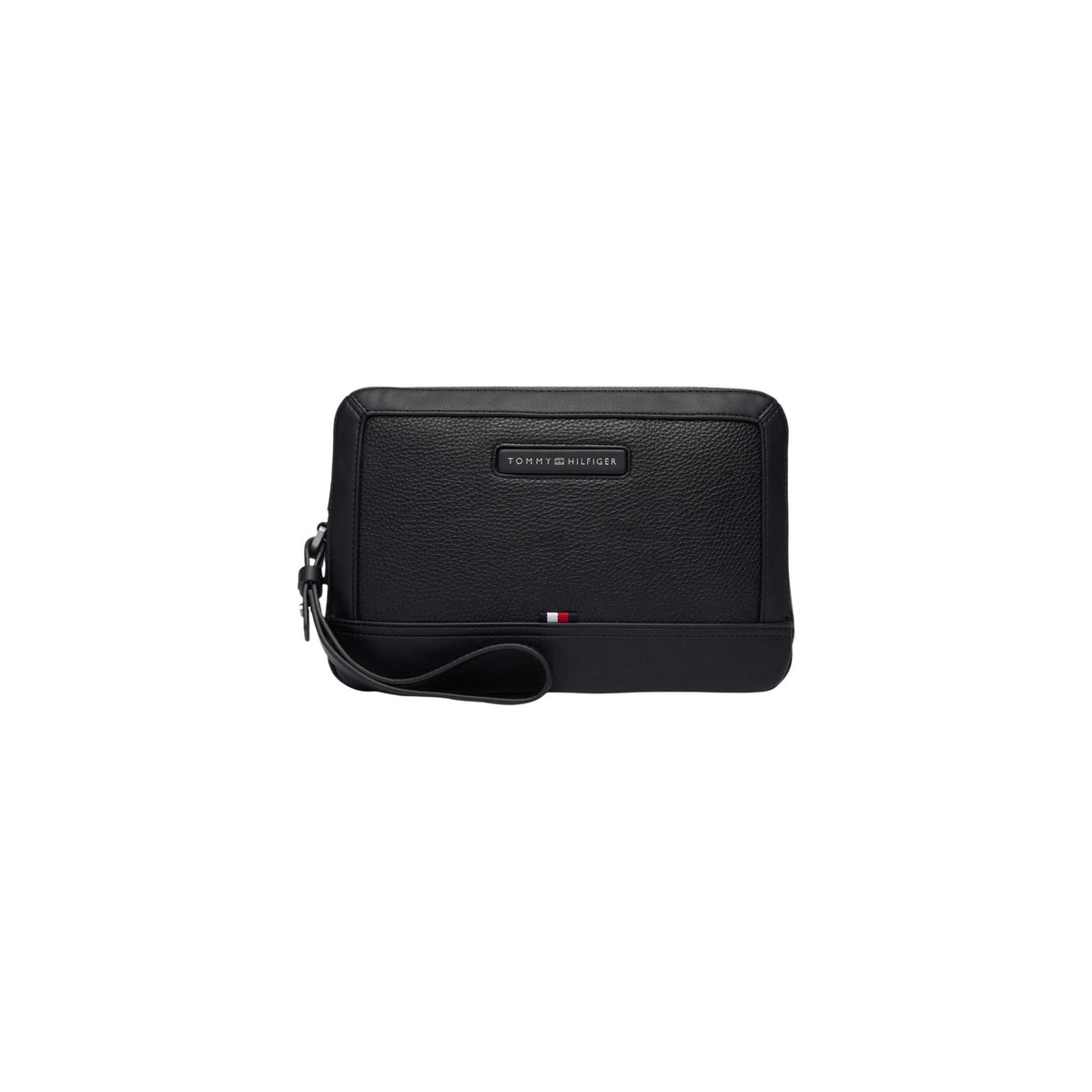 Image 1 : Pochette homme Tommy Hilfiger zippée en cuir grainé noir, vue de face avec badge signature et drapeau tricolore, dragonne de poignet — Delvale