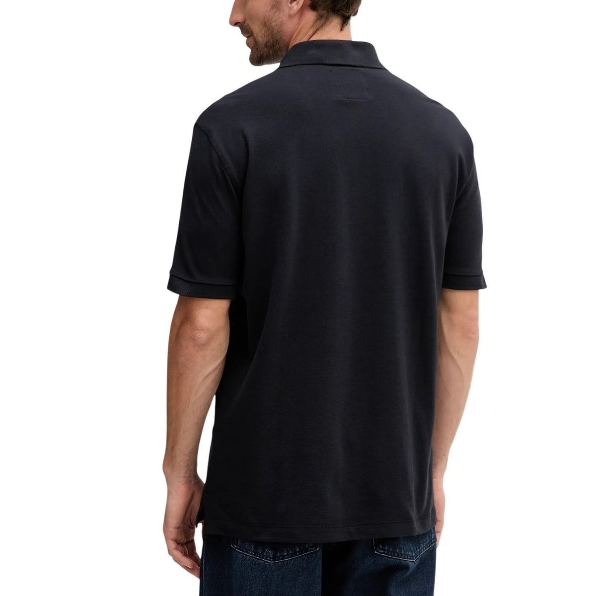 Polo Armani Exchange homme noir piqué logo AX — vue de dos portée — Delvale