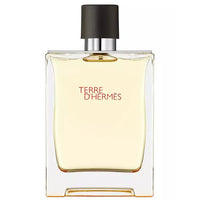 Image 1 : Flacon Hermès Terre d'Hermès Eau de Toilette 200 ml, design rectangulaire transparent avec bouchon anthracite et cerclage argenté, inscription rouge Terre d'Hermès sur fond blanc — Delvale