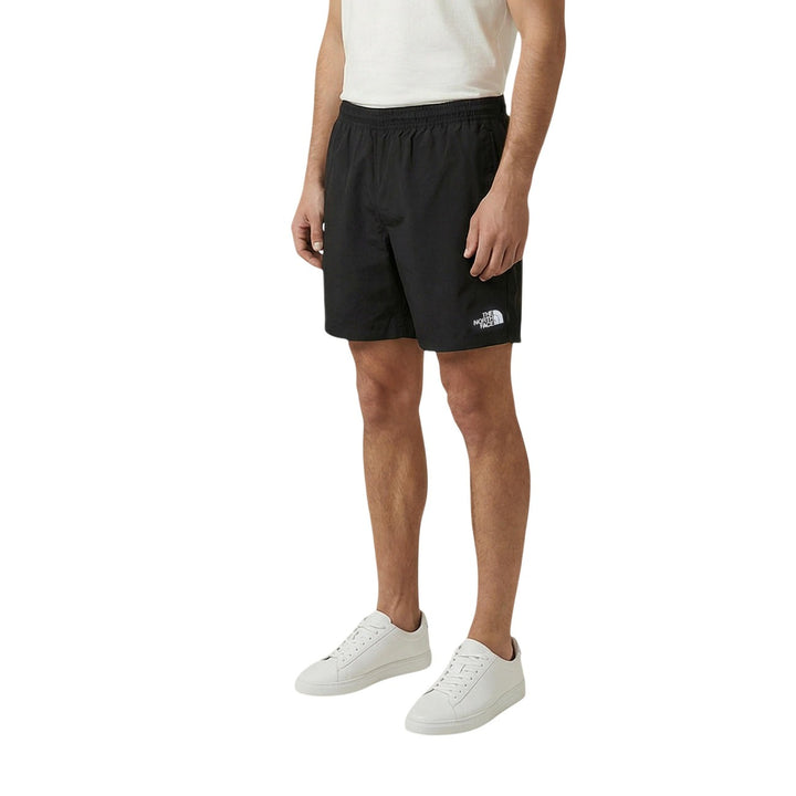 The North Face Short Homme Noir Nylon Technique Poches Frontales Vue de 3/4 — Delvale