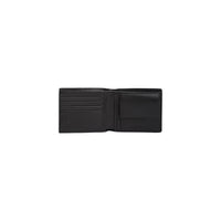 Image 4 : Portefeuille Tommy Hilfiger homme cuir noir posé sur fond neutre, vue d'ensemble — Delvale