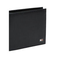 Image 3 : Portefeuille Tommy Hilfiger homme cuir noir, vue trois quarts montrant le volume et le format compact — Delvale