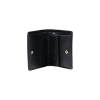Image 5 : Portefeuille Armani Exchange femme noir posé, vue d'ensemble montrant la sangle et le logo AX — Delvale