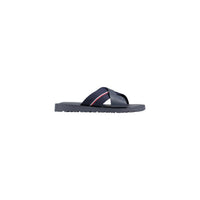 Image 1 : Mules homme Tommy Hilfiger en cuir grainé marine, bandes croisées avec ruban tricolore signature, vue de profil gauche — Delvale