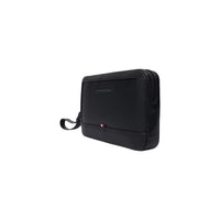 Image 3 : Vue de trois quarts de la pochette homme Tommy Hilfiger noire, texture cuir grainé et dragonne souple visible — Delvale