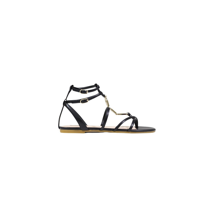 Image 1 : Sandale spartiate Liu Jo femme noire vue de profil, lanières fines, boucles dorées et ornements métalliques sur l'avant-pied — Delvale