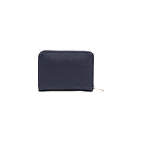 Image 2 : Vue de face du portefeuille Tommy Hilfiger femme zippé marine, détail des clous décoratifs rouge et blanc en colonnes verticales — Delvale