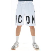 Image 1 : Bermuda Icon homme blanc avec grand logo oversize imprimé en noir, vue de face portée avec sneakers New Balance — Delvale