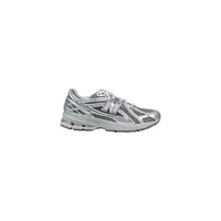 New Balance 1906R homme argenté vue de profil extérieur avec finition métallisée