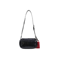 Image 3 : Vue de profil du sac Desigual noir avec sangle bandoulière cloutée et finition vernis craquelé — delvale