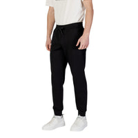 Armani Exchange jogging homme noir détail bas de jambe côtes élastiques vue rapprochée — Delvale