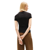 Image 3 : Vue de profil du t-shirt Tommy Hilfiger Jeans noir femme montrant la coupe féminine ajustée — Delvale