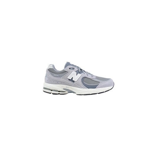 New Balance 2002R grise unisex vue de profil extérieur avec semelle blanche