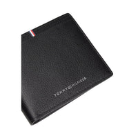 Image 3 : Portefeuille Tommy Hilfiger noir ouvert, compartiments porte-cartes et poche à billets visibles — Delvale
