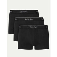 Image 1 : Lot de 3 boxers trunks Calvin Klein Underwear homme coloris noir avec ceinture élastique logo blanc sur fond blanc — Delvale