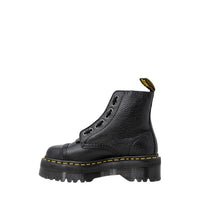 Image 2 : Vue détaillée des bottes Dr. Martens Sinclair noires design monochrome — delvale