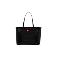 Image 1 : Tote bag Tommy Hilfiger femme coloris noir, vue de face, anse longue et badge logo Flag emblématique — Delvale