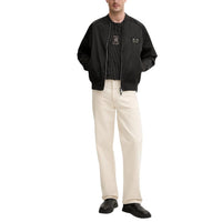 Image 3 : Vue profil du t-shirt homme Armani Exchange noir rayé, coupe moderne — Delvale