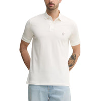 Polo Armani Exchange homme blanc piqué logo AX brodé — vue de face portée — Delvale