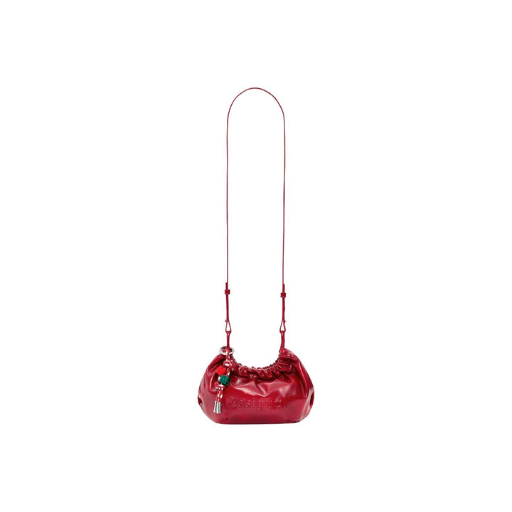 Image 1 : Sac bandoulière Desigual rouge verni forme coussin avec breloques colorées — delvale